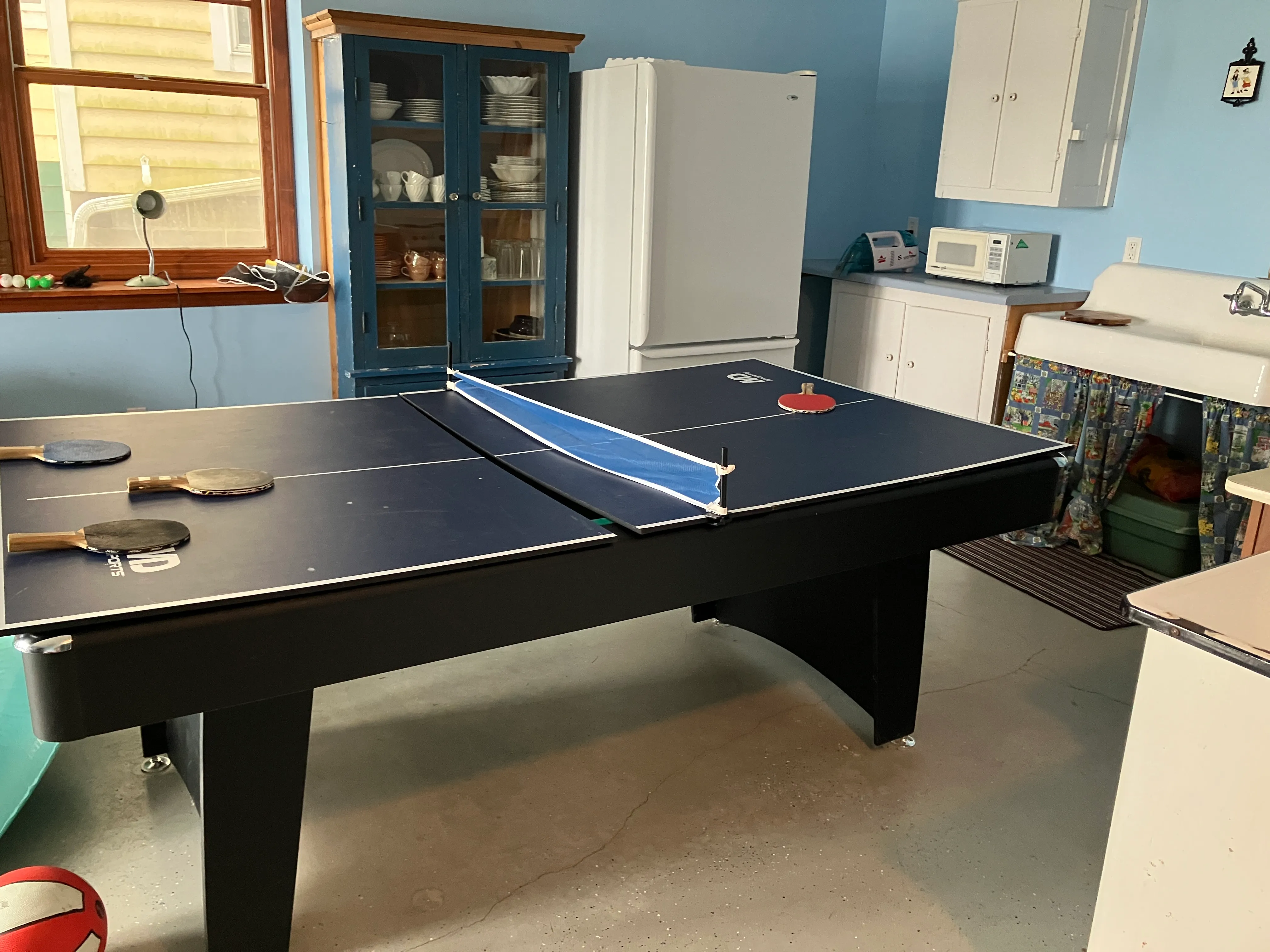 Ping pong and pool table combo in the rec area.